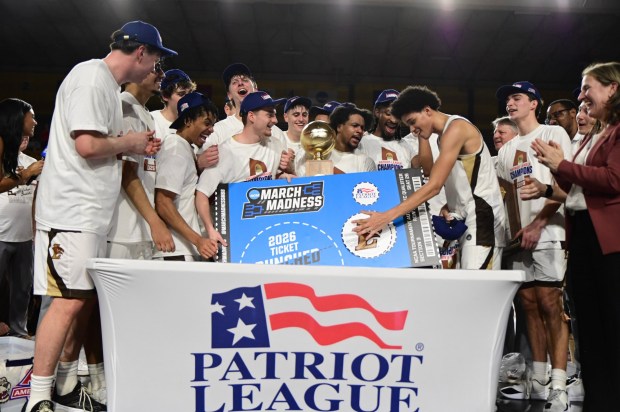 The Lehigh men's basketball team celebrates its win over No. 4 seed Boston University 74-60 on Wednesday night, March 11, 2026, to win the Patriot League Tournament and clinch its first NCAA Tournament berth since 2012. (Courtesy Lehigh Sports Communications)