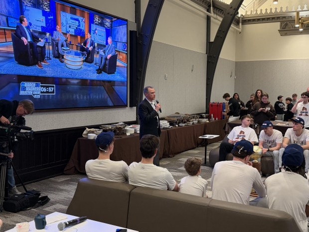 Lehigh head coach Brett Reed talks to his team during the NCAA Basketball Tournament selection show on Sunday night. The Mountain Hawks, who won the Patriot League to qualify for the tournament, will play Prairie View A&M on Wednesday in Dayton. (Derek Bast/Special to the Morning Call)