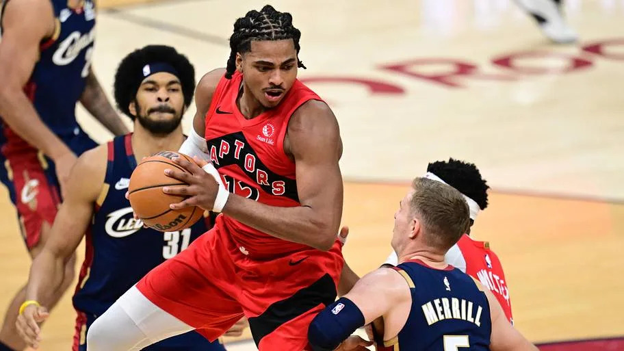 Toronto Raptors forward Collin Murray-Boyles grabs a rebound against Cleveland Cavaliers guard Sam Merrill
