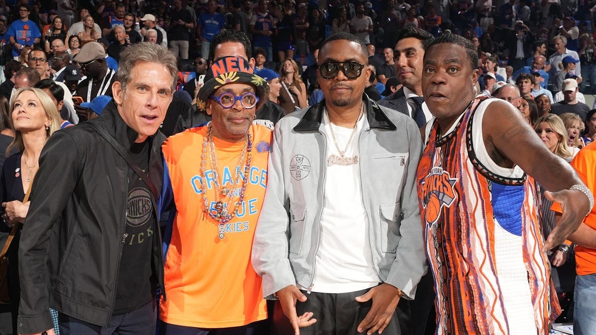 Ben Stiller, Spike Lee, Nas, and Tracy Morgan posing together at Madison Square Garden.