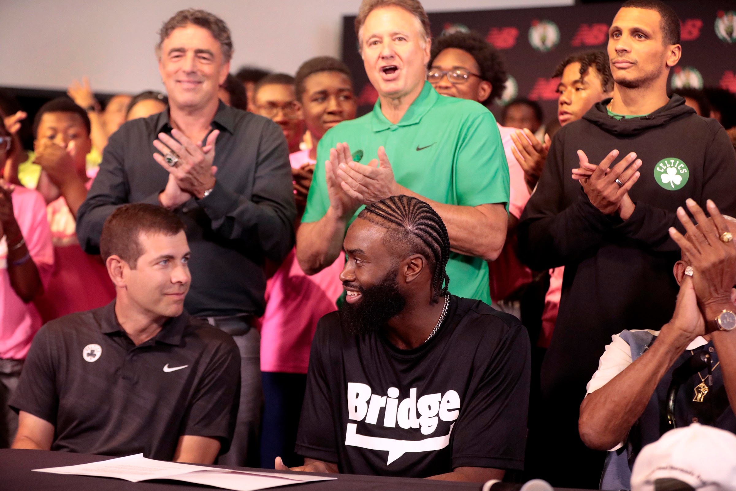 Cambridge, MA - July 26: Boston Celtics SG Jaylen Brown looks at President of Basketball Operations Brad Stevens after signing his supermax contract extension. Standing behind them are, from left, Celtics Governor Wyc Grousbeck, Managing General Partner Steve Pagliuca, and head coach Joe Mazzulla. (Photo by Pat Greenhouse/The Boston Globe via Getty Images)