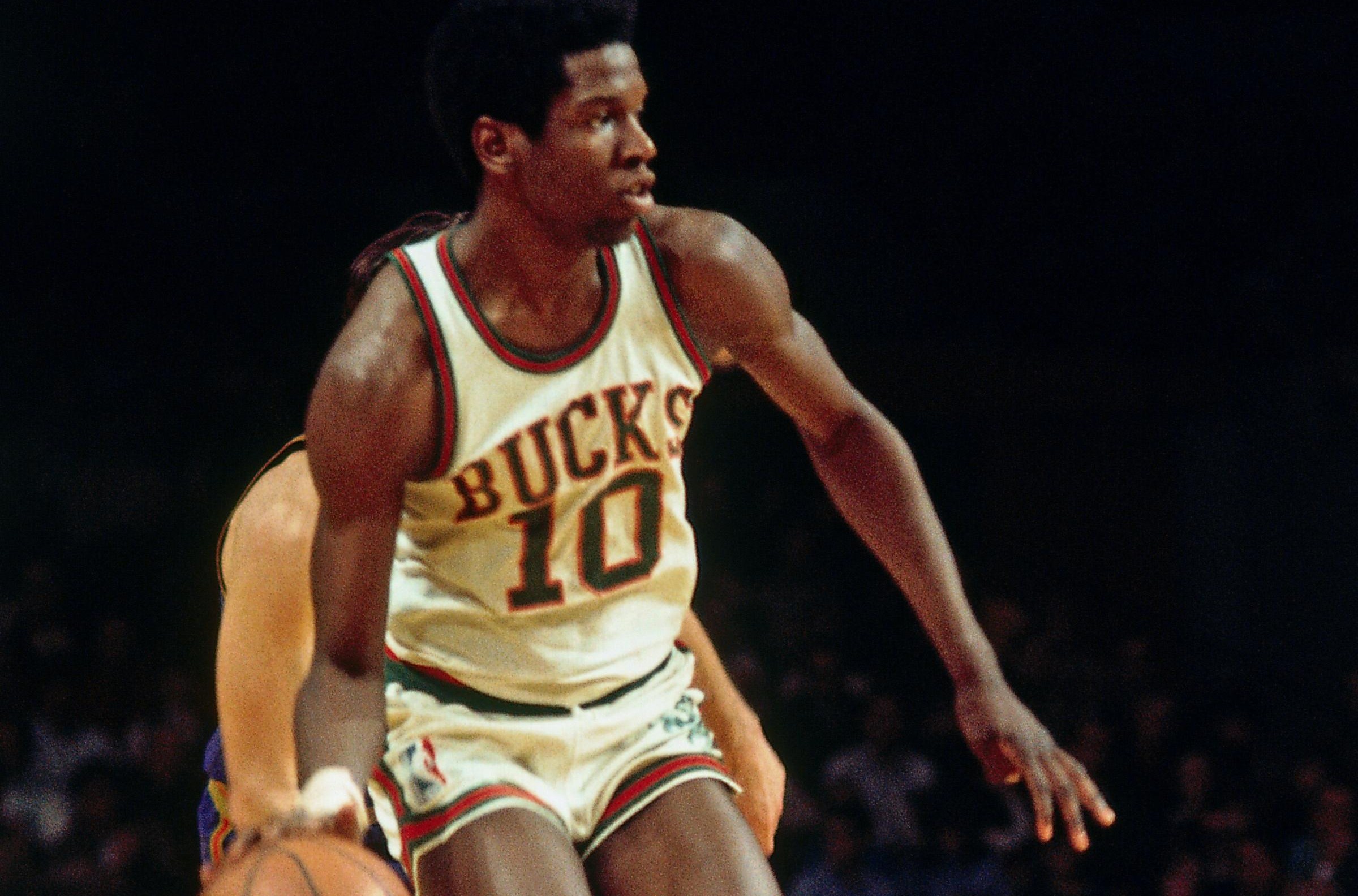MILWAUKEE, WI - 1971: Bob Dandridge of the Milwaukee Bucks dribbles the ball during the New York Knicks game against the Milwaukee Bucks circa,1971 at the Milwaukee Arena in Milwaukee, Wisconsin. NOTE TO USER: User expressly acknowledges and agrees that, by downloading and/or using this photograph, user is consenting to the terms and conditions of the Getty Images License Agreement. Mandatory Copyright Notice: Copyright 1971 NBAE (Photo by Vernon Biever/NBAE via Getty Images)