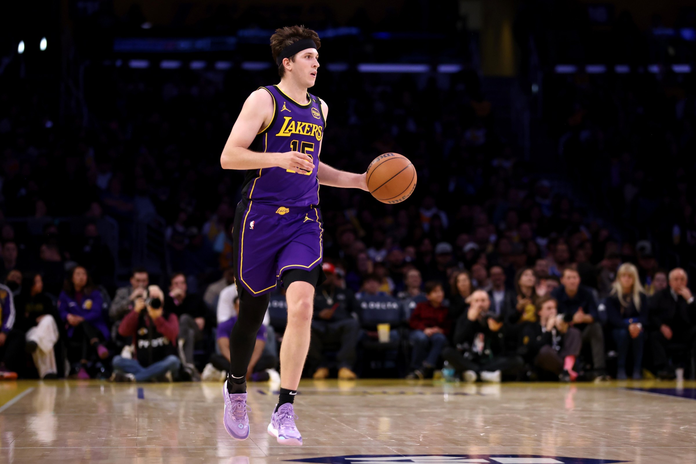 LOS ANGELES, CALIFORNIA - JANUARY 17: Austin Reaves #15 of the Los Angeles Lakers brings the ball up court during the fourth quarter against the Brooklyn Nets at Crypto.com Arena on January 17, 2025 in Los Angeles, California. NOTE TO USER: User expressly acknowledges and agrees that, by downloading and/or using this Photograph, user is consenting to the terms and conditions of the Getty Images License Agreement. (Photo by Katelyn Mulcahy/Getty Images)