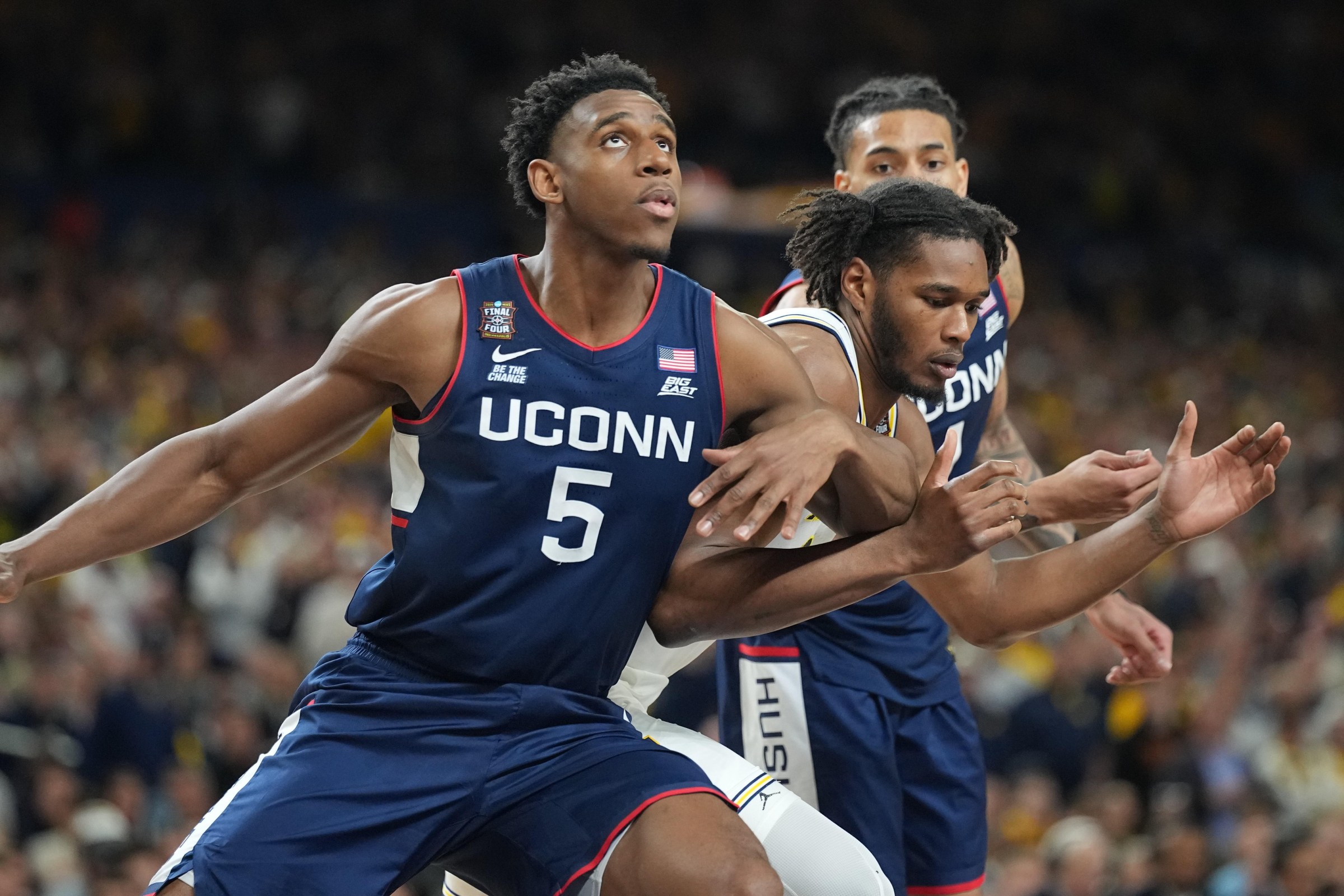 College Basketball: NCAA Finals: UConn Tarris Reed Jr. (5) in action, boxes out vs Michigan at Lucas Oil Stadium. Indianapolis, IN 4/6/2026 CREDIT: Erick W. Rasco (Photo by Erick W. Rasco/Sports Illustrated via Getty Images) (Set Number: X164879 TK1)
