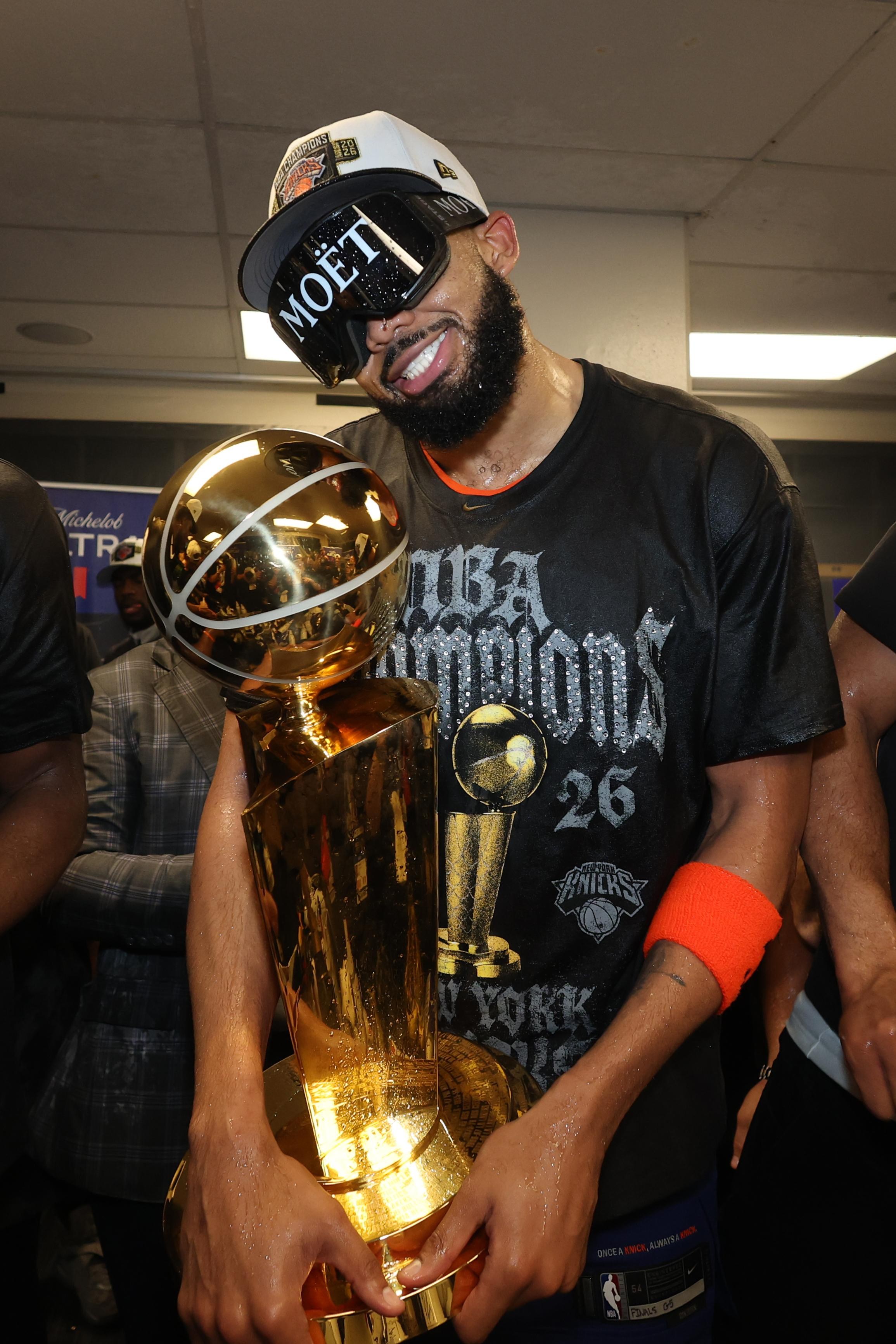 SAN ANTONIO, TX - JUNE 13: Karl-Anthony Towns #32 of the New York Knicks poses for a photo with the Larry O’Brien Championship Trophy after winning the NBA Finals against the San Antonio Spurs during Game Five of the 2026 NBA Finals on June 13, 2026 at Frost Bank Center in San Antonio, Texas. NOTE TO USER: User expressly acknowledges and agrees that, by downloading and or using this photograph, User is consenting to the terms and conditions of the Getty Images License Agreement. Mandatory Copyright Notice: Copyright 2026 NBAE(Photo by Nathaniel S. Butler/NBAE via Getty Images)