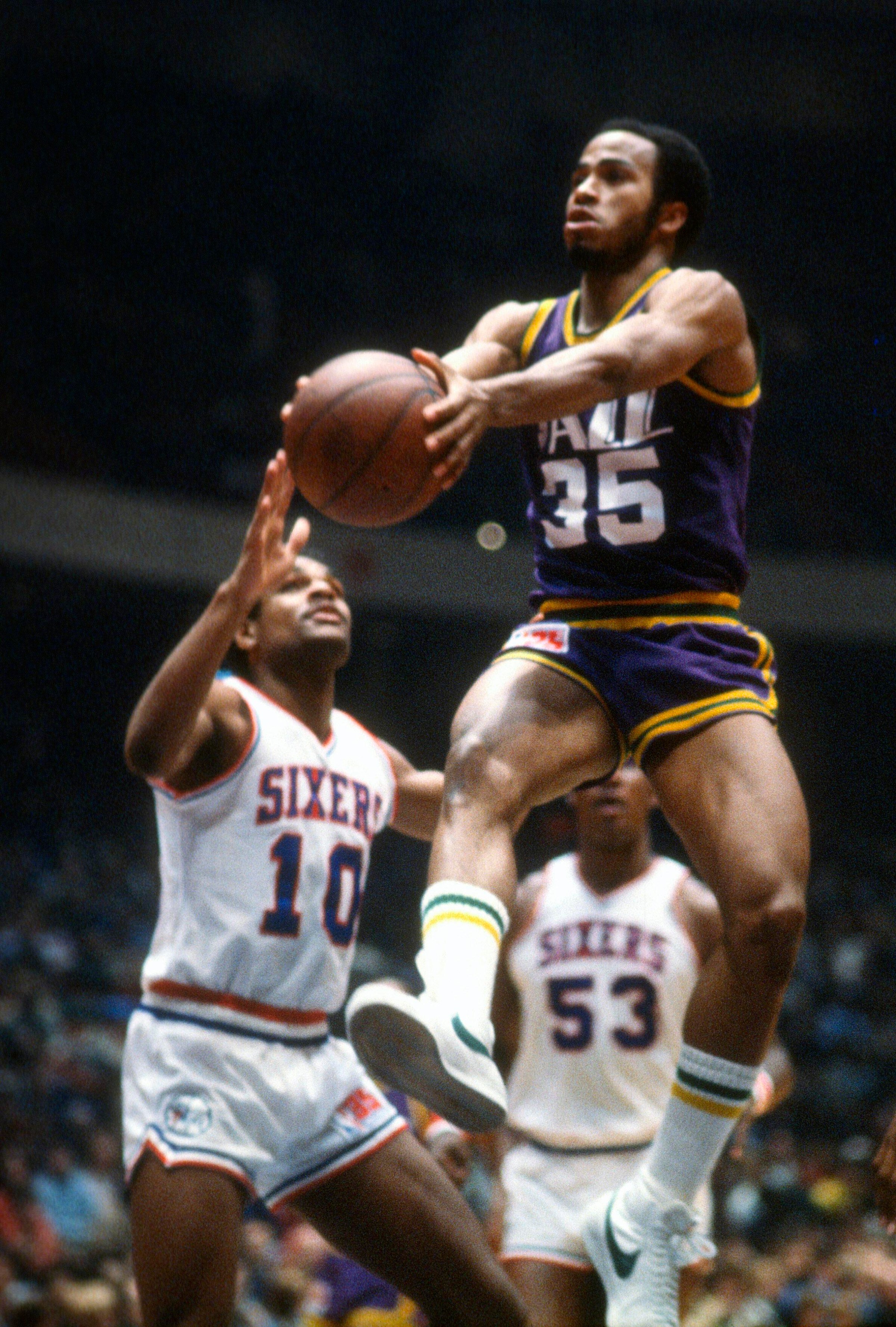 PHILADELPHIA, PA - CIRCA 1980: Darrell Griffith #35 of the Utah Jazz shoots over Maurice Cheeks #10 of the Philadelphia 76ers during an NBA basketball game circa 1980 at The Spectrum in Philadelphia, Pennsylvania. Griffith played for the Jazz from 1980-91. (Photo by Focus on Sport/Getty Images)