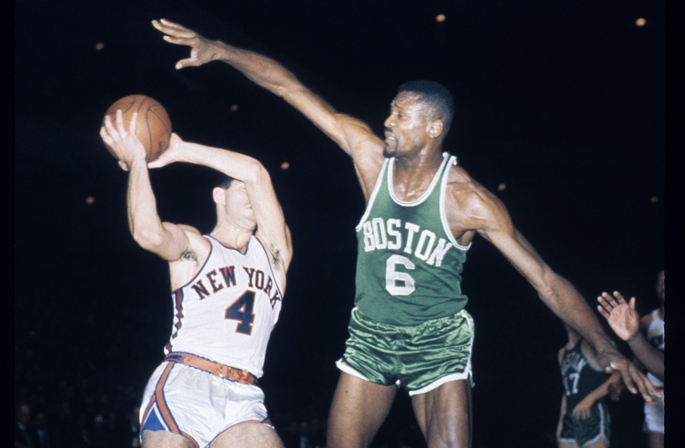 NEW YORK, NY - CIRCA 1960’s: Bill Russell #6 of the Boston Celtics defends the ball against the New York Knicks during a circa 1960’s NBA basketball game. Russell played for the Celtics from 1956 - 69. (Photo by Focus on Sport/Getty Images)
