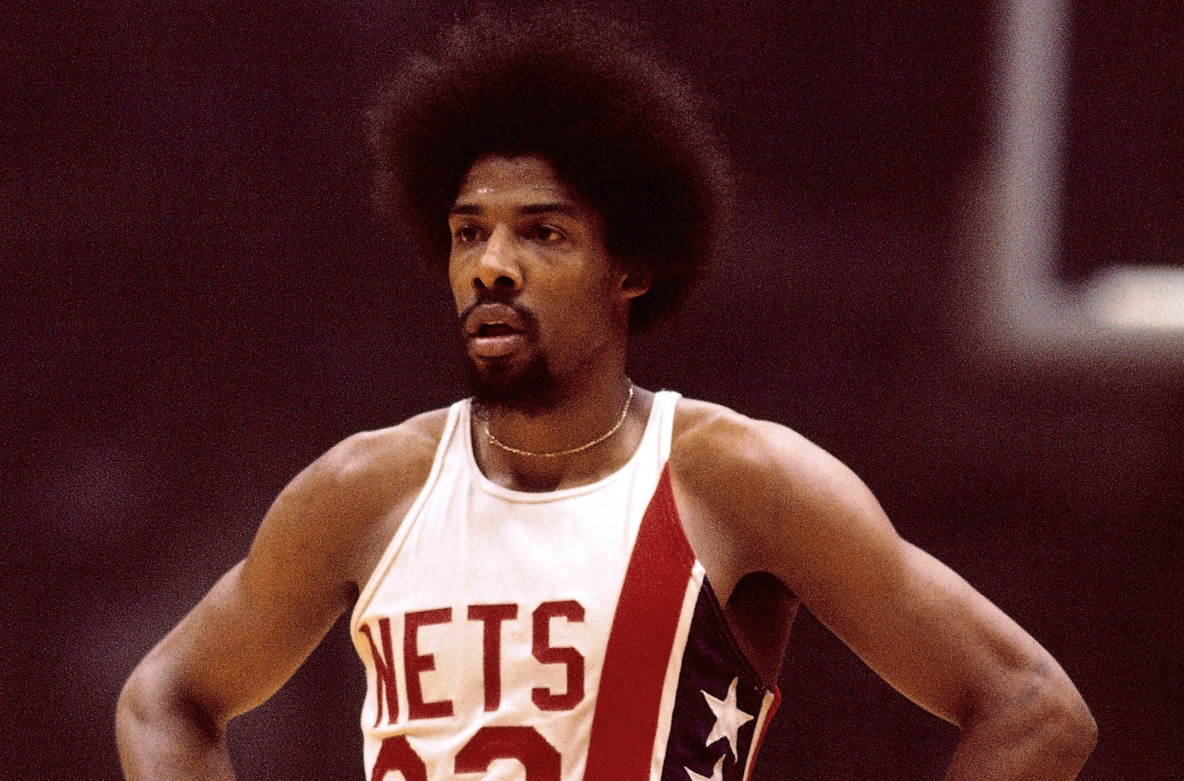 BOSTON - 1974: Julius Erving #32 of the New Jersey Nets looks on during a game against the Boston Celtics played circa 1973-1974 at the Boston Garden in Boston, Massachusetts. NOTE TO USER: User expressly acknowledges and agrees that, by downloading and or using this photograph, User is consenting to the terms and conditions of the Getty Images License Agreement. Mandatory Copyright Notice: Copyright 1974 NBAE (Photo by Dick Raphael/NBAE via Getty Images)