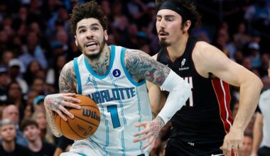 Charlotte Hornets guard LaMelo Ball (1) drives to the basket against Miami Heat forward Jaime Jaquez Jr. during the first half of an NBA play-in tournament basketball game in Charlotte, N.C., Tuesday, April 14, 2026. (AP Photo/Nell Redmond)