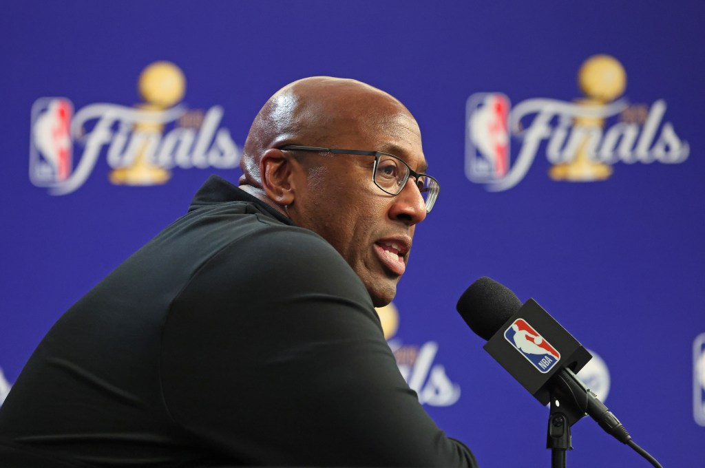 Mike Brown, head coach of the New York Knicks, addresses the media during a post-game press conference.