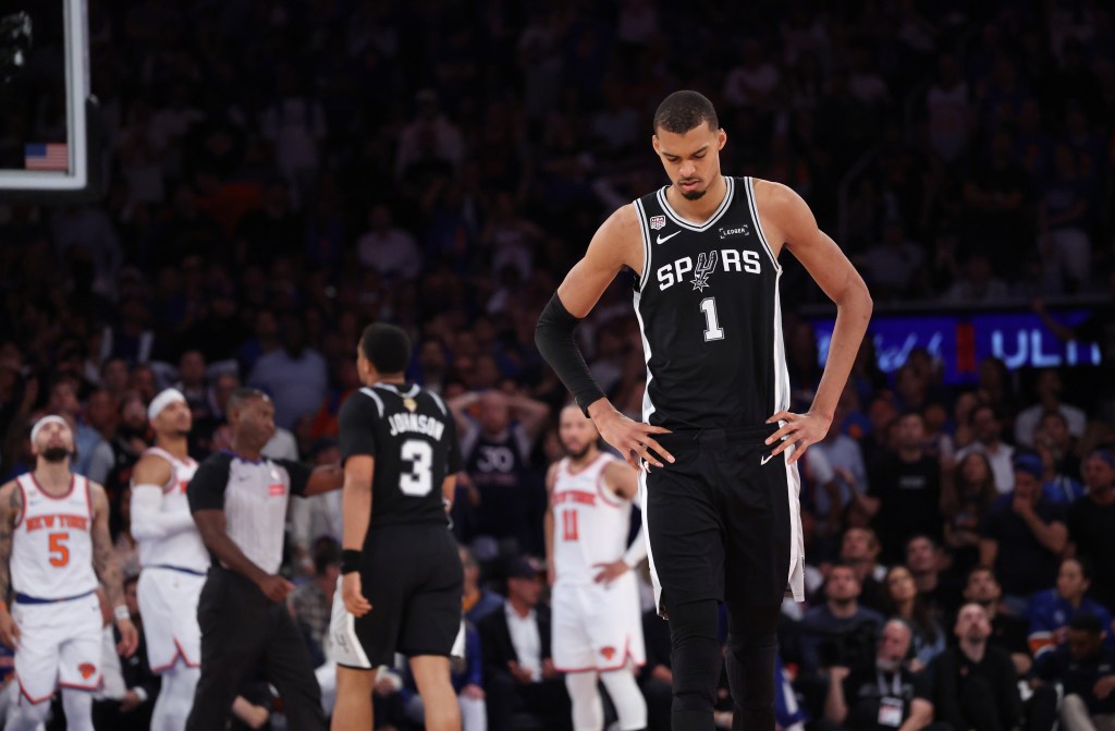 Victor Wembanyama #1, with his head down, walking down court during the 4th quarter. The Knicks beat the Spurs 107-106.
