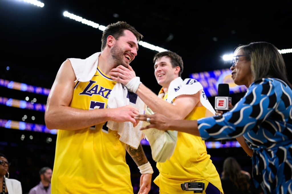 Apr 21, 2026; Los Angeles, California, USA; Los Angeles Lakers guard Luka Doncic (77) and guard Austin Reaves (15) look on from the bench during the second half of game two of the first round of the 2026 NBA Playoffs against the Houston Rockets at Crypto.com Arena. Mandatory Credit: Jayne Kamin-Oncea-Imagn Images