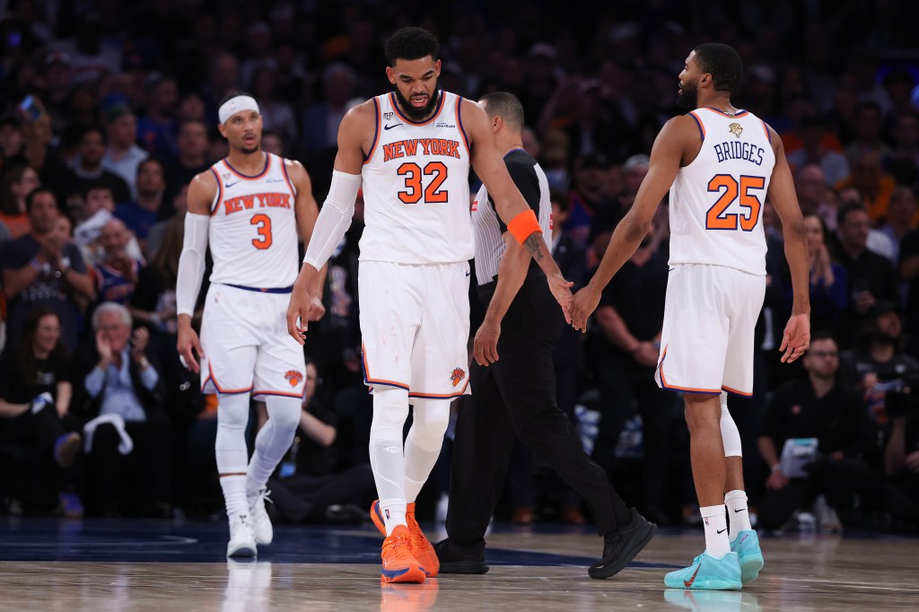 Karl-Anthony Towns, Mikal Bridges, and another Knicks player on the court during the 2026 NBA Finals.