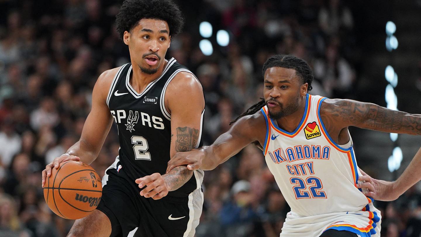 May 28, 2026; San Antonio, Texas, USA; San Antonio Spurs guard Dylan Harper (2) dribbles the ball past Oklahoma City Thunder guard Cason Wallace (22) in the first half during game six of the western conference finals for the 2026 NBA playoffs at Frost Bank Center. Mandatory Credit: Dustin Safranek-Imagn Images