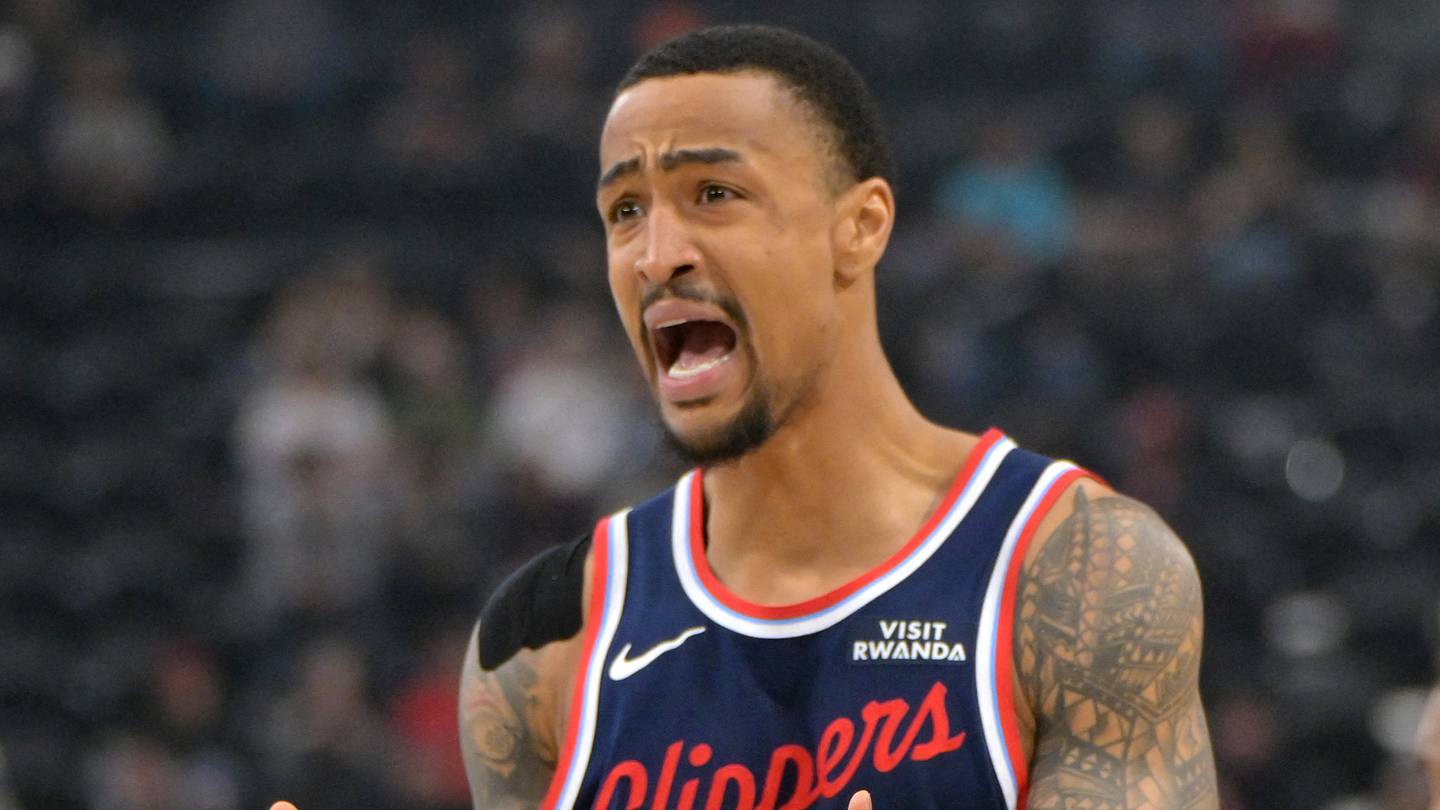 Feb 4, 2026; Inglewood, California, USA; Los Angeles Clippers forward John Collins (20) reacts after he was charged with a foul on Cleveland Cavaliers guard Donovan Mitchell (45) in the first half at Intuit Dome. Mandatory Credit: Jayne Kamin-Oncea-Imagn Images
