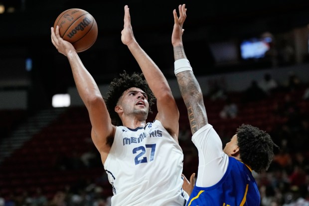 Memphis Grizzlies' Cameron Boozer shoots against Golden State Warriors' Yaxel Lendeborg during the second half of an NBA Summer League championship basketball game Sunday, July 19, 2026, in Las Vegas. (AP Photo/John Locher)