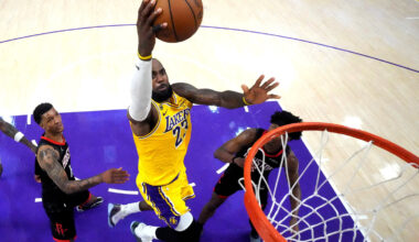 Los Angeles Lakers forward LeBron James (23) shoots the ball against Houston Rockets forward Jabari Smith Jr. (10) and guard Amen Thompson (1) in the second half during game one of the first round of the 2026 NBA Playoffs at Crypto.com Arena.