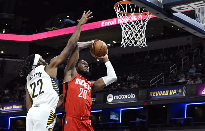 Oct 14, 2022; Indianapolis, Indiana, USA; Houston Rockets forward Bruno Fernando (20) attempts a shot while defended by Indiana Pacers forward Isaiah Jackson (22) during the first quarter at Gainbridge Fieldhouse. Mandatory Credit: Marc Lebryk-USA TODAY Sports