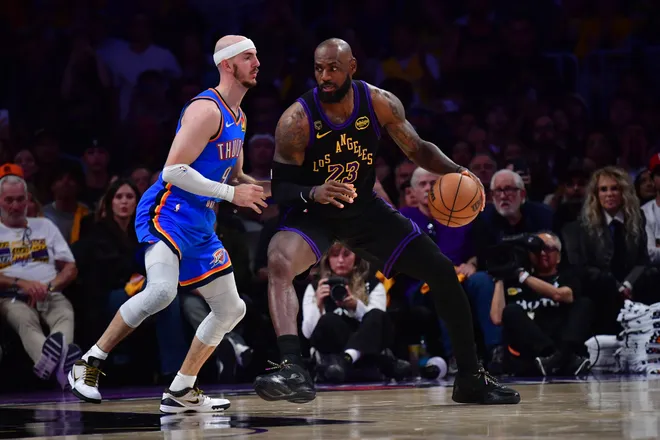 May 11, 2026; Los Angeles, California, USA; Los Angeles Lakers forward LeBron James (23) moves the ball against Oklahoma City Thunder guard Alex Caruso (9) during the second half in game four of the second round of the 2026 NBA Playoffs at Crypto.com Arena. Mandatory Credit: Gary A. Vasquez-Imagn Images
