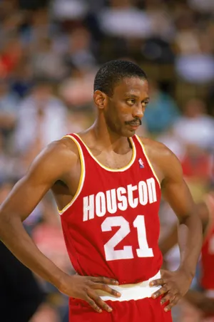 1989: Eric Floyd #21 of the Houston Rockets looks on during a game in the1989-90 season. NOTE TO USER: User expressly acknowledges and agrees that, by downloading and/or using this Photograph, User is consenting to the terms and conditions of the Getty Images License Agreement. (Photo by: Ken Levine/Getty Images)