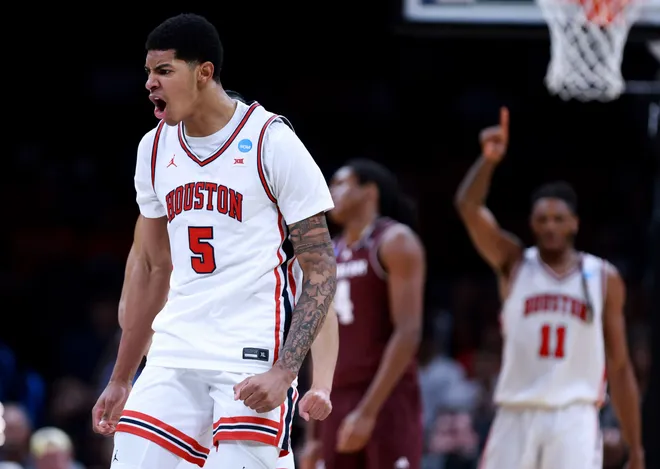 Houston's Chris Cenac Jr. (5) cheers during a second-round game in the NCAA men's basketball tournament between Houston Cougars and Texas A & M Aggies at Paycom Center in Oklahoma City, Saturday March 21, 2026.