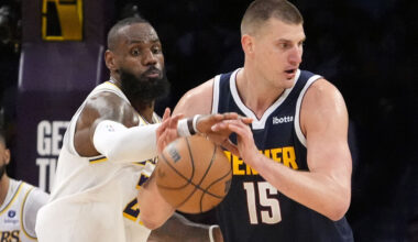 Los Angeles Lakers forward LeBron James, left, knocks the ball from the hands of Denver Nuggets center Nikola Jokic during the second half in Game 4 of an NBA basketball first-round playoff series Saturday, April 27, 2024, in Los Angeles. (AP Photo/Mark J. Terrill)
