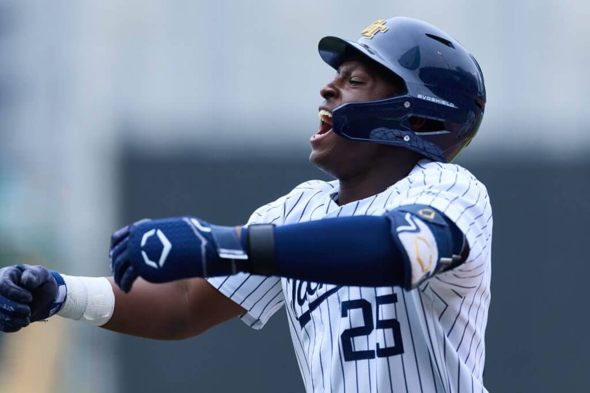 Vahn Lackey celebrates after hitting a home run.