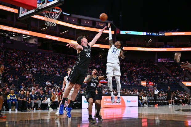 Golden State Warriors' Deivon Smith (36) shoots over San Antonio Spurs' Harry Wessels (38) in the first quarter of their California Classic Summer League game at Chase Center in San Francisco, Calif., on Sunday, July 5, 2026. (Jose Carlos Fajardo/Bay Area News Group)