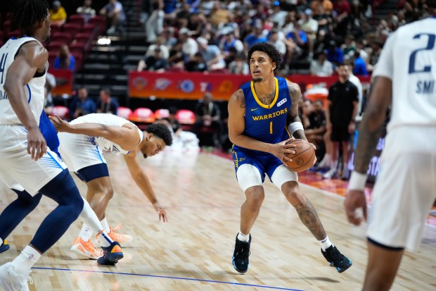 Golden State Warriors' Yaxel Lendeborg drives against the Dallas Mavericks during the first half of an NBA Summer League basketball game Thursday, July 9, 2026, in Las Vegas. (AP Photo/John Locher)