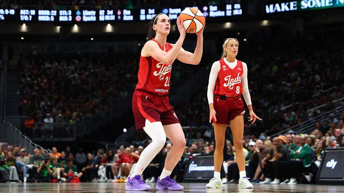 Caitlin Clark shoots a free throw during an Indiana Fever game