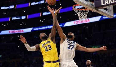 LeBron James attempts a shot while Minnesota Timberwolves center Rudy Gobert contests at the basket during a game against the Los Angeles Lakers.