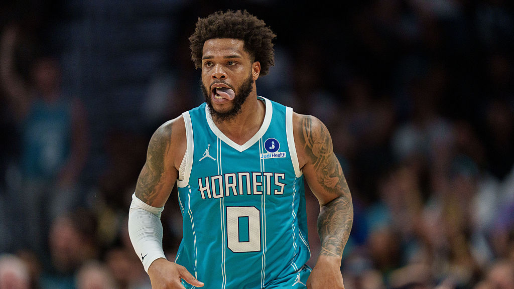 miles bridges sticks his tongue out in a charlotte hornets uniform