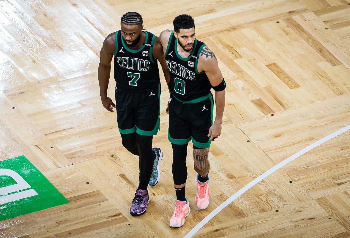 Jaylen Brown puts his arm around Jayson Tatum during the 2024 NBA Finals.