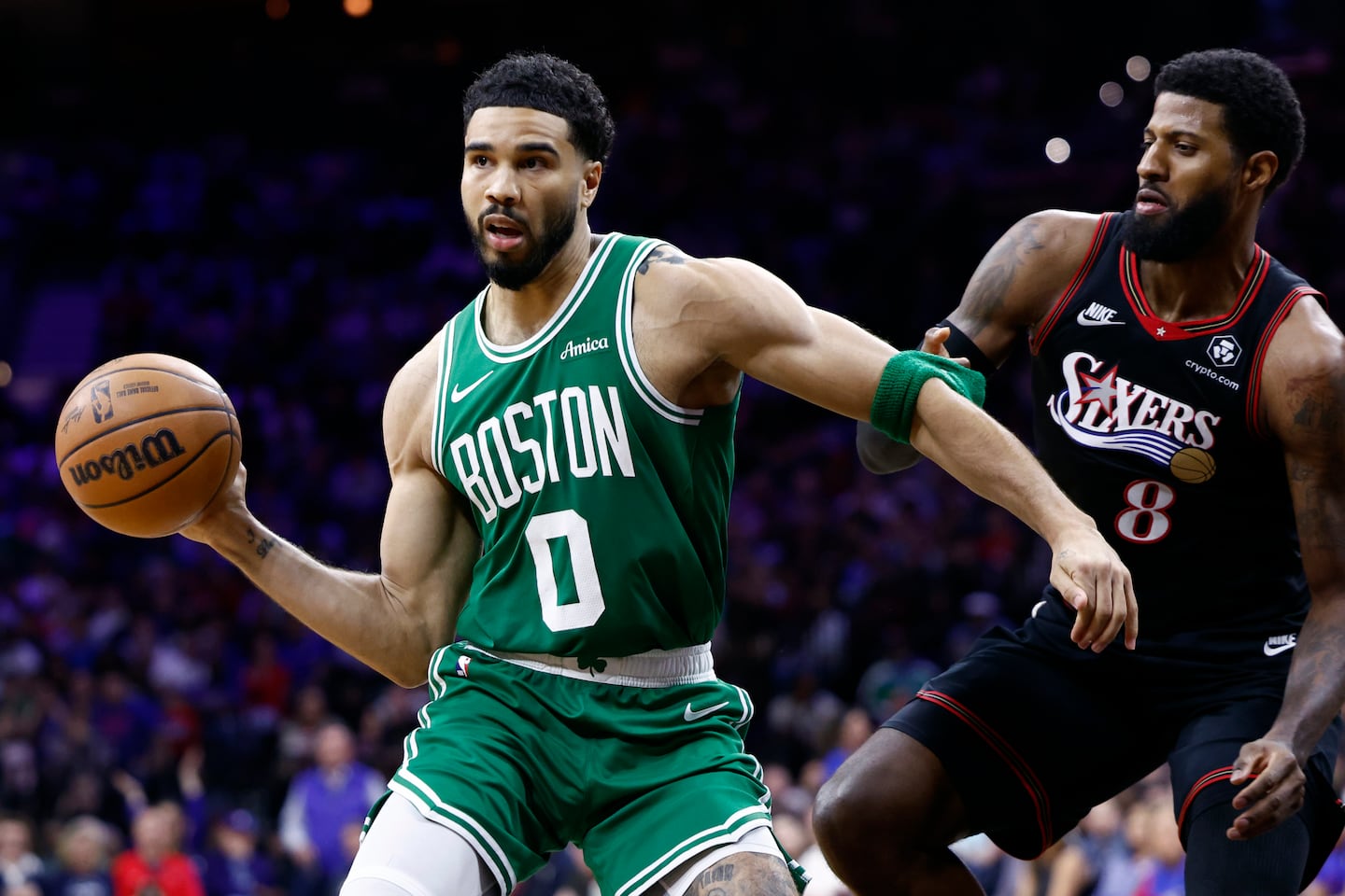 Paul George (right) battled Jayson Tatum and the Celtics in April's first-round NBA playoff series won by George's 76ers.