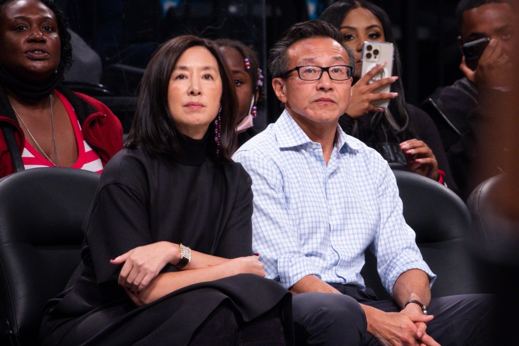 Nets owner Joseph Tsai and his wife Clara Wu sitting courtside.
