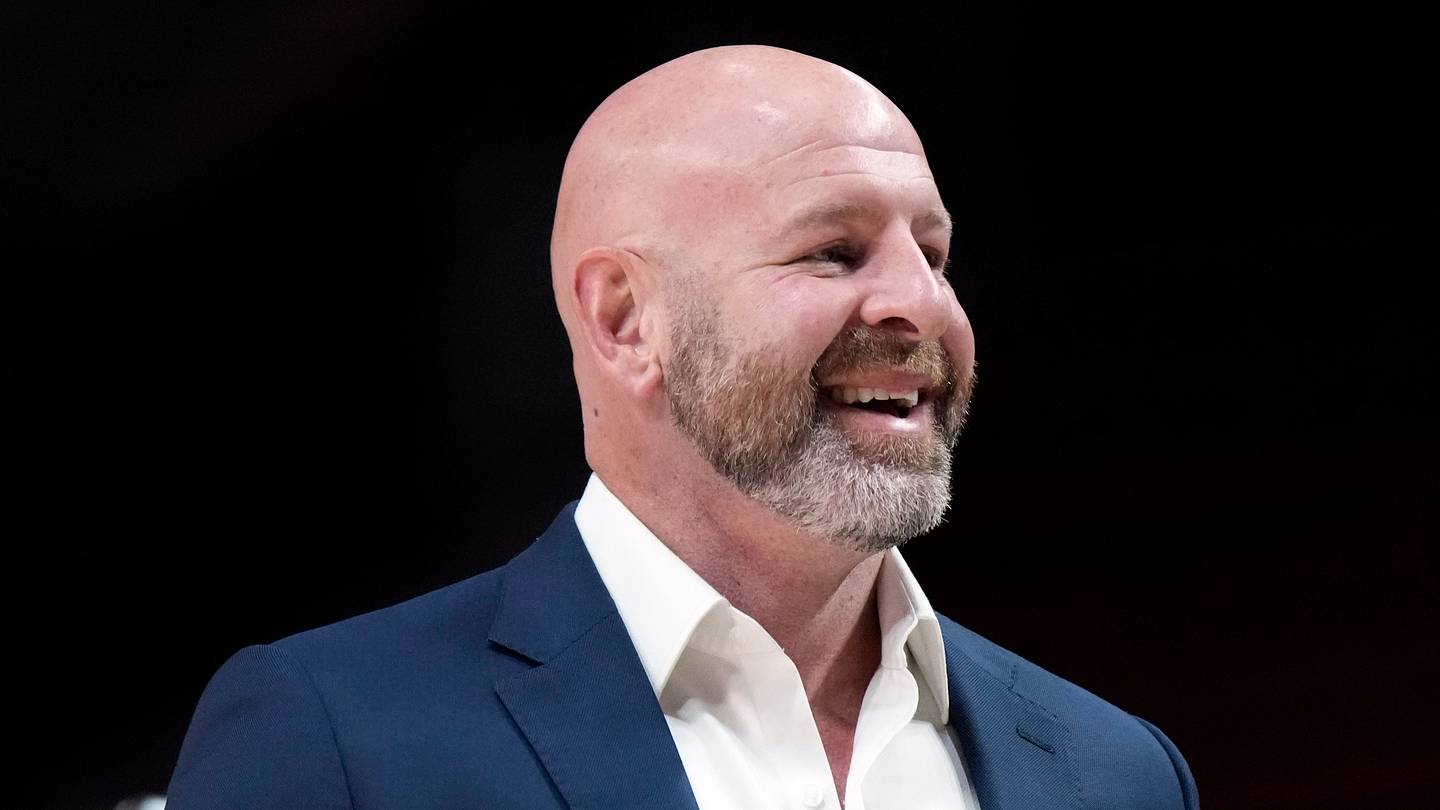 Oct 25, 2024; Portland, Oregon, USA; Portland Trail Blazers general manager Joe Cronin smiles as players warm up before a game against the New Orleans Pelicans at Moda Center. Mandatory Credit: Soobum Im-Imagn Images