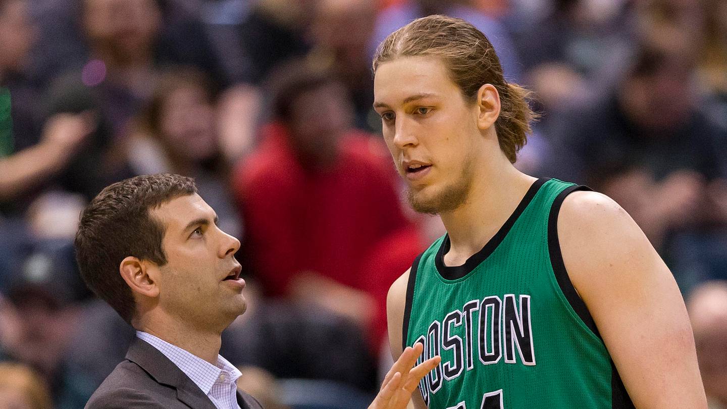 Feb 9, 2016; Milwaukee, WI, USA; Boston Celtics head coach Brad Stevens (L) talks with center Kelly Olynyk (41) during the third quarter against the Milwaukee Bucks at BMO Harris Bradley Center. Mandatory Credit: Jeff Hanisch-USA TODAY Sports