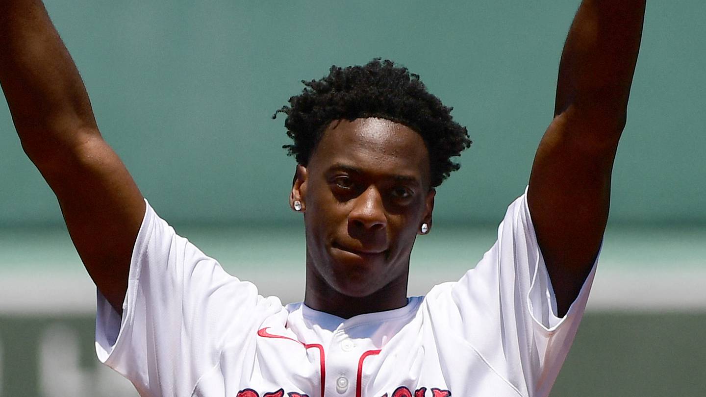 Jun 27, 2026; Boston, Massachusetts, USA;  NBA number one draft pick AJ Dybantsa reacts to the crowd after throwing out the first pitch before a game between the Boston Red Sox and New York Yankees at Fenway Park. Mandatory Credit: Bob DeChiara-Imagn Images