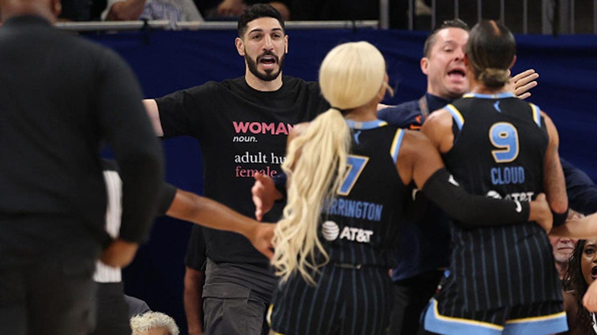 Enes Kanter Freedom and Natasha Cloud yell at one another during a Chicago Sky basketball game.