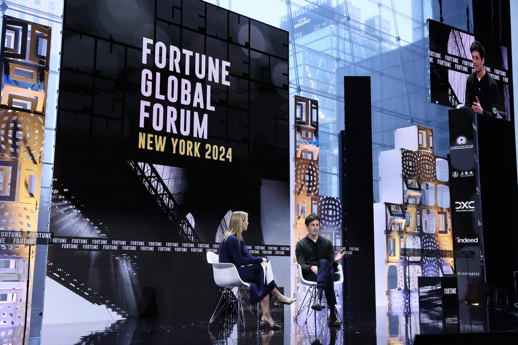 Alyson Shontell and Joshua Kushner seated onstage at a forum