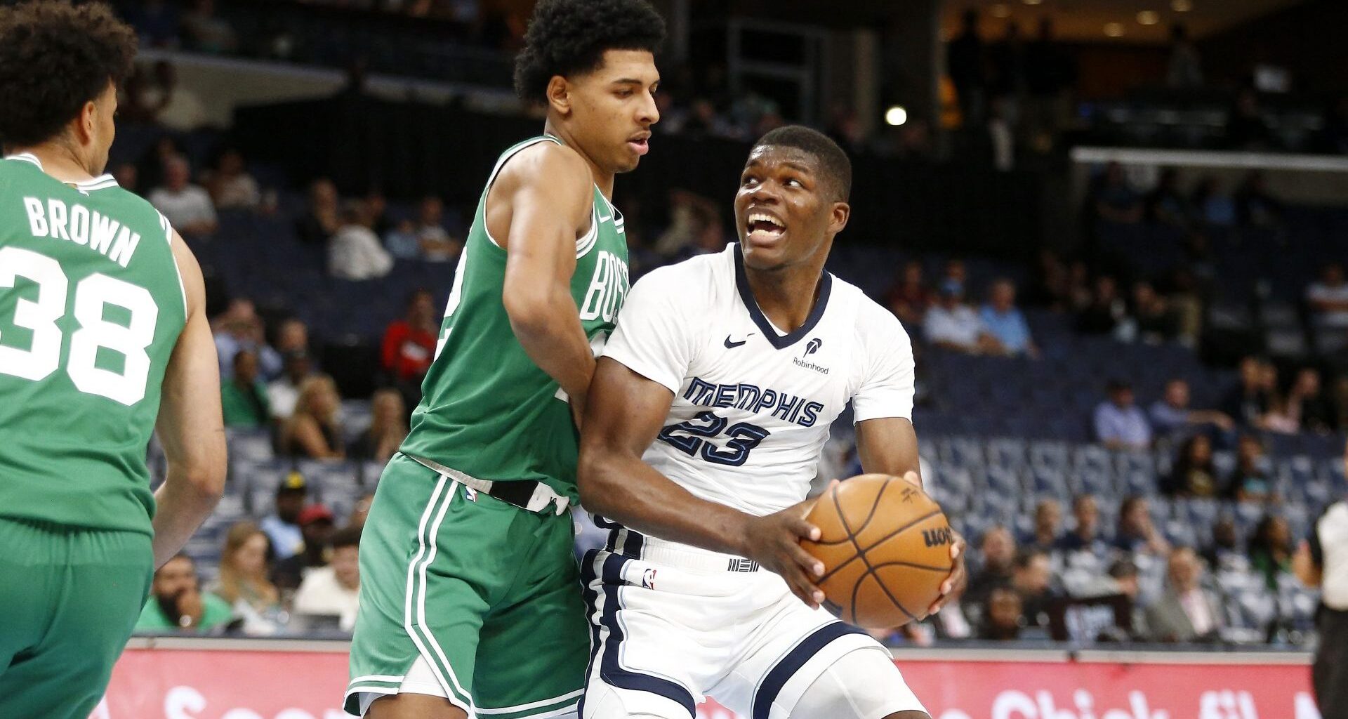 Oct 8, 2025; Memphis, Tennessee, USA; Memphis Grizzlies forward Cedric Coward (23) drives to the basket as Boston Celtics guard RJ Luis Jr. (12) defends during the fourth quarter at FedExForum