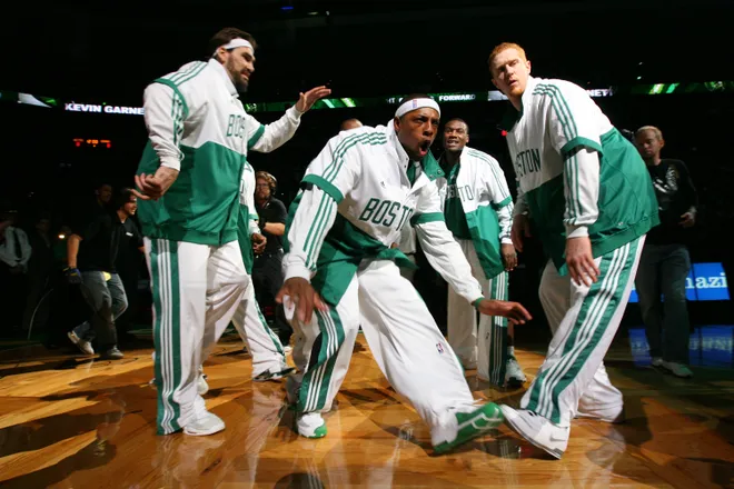 BOSTON - NOVEMBER 2: Paul Pierce #34 is enters the court welcomed by teammates Scot Pollard #66 and Brian Scalabrine #44 of the Boston Celtics before the game against the Washington Wizards on November 2, 2007 at the TD Banknorth Garden in Boston, Massachusetts. NOTE TO USER: User expressly acknowledges and agrees that, by downloading and or using this Photograph, user is consenting to the terms and conditions of the Getty Images License Agreement. Mandatory Copyright Notice: Copyright 2007 NBAE (Photo by Jesse D. Garrabrant/NBAE via Getty Images)