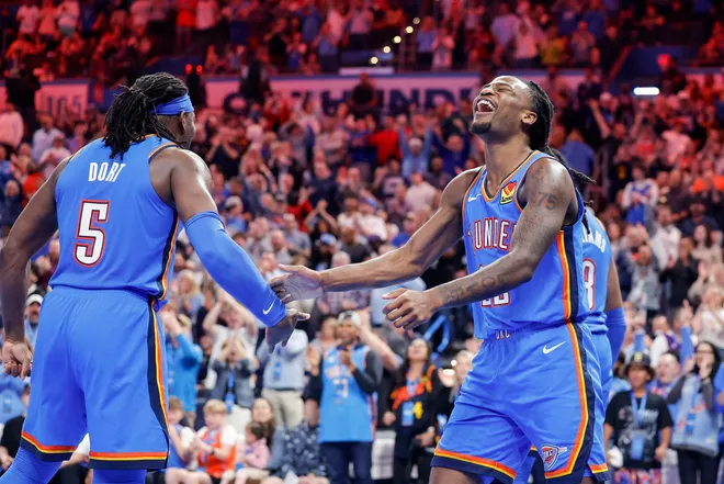 Apr 8, 2025; Oklahoma City, Oklahoma, USA; Oklahoma City Thunder guard Cason Wallace (22) celebrates with Oklahoma City Thunder guard Luguentz Dort (5) after scoring against the Los Angeles Lakers during the second half at Paycom Center. Mandatory Credit: Alonzo Adams-Imagn Images