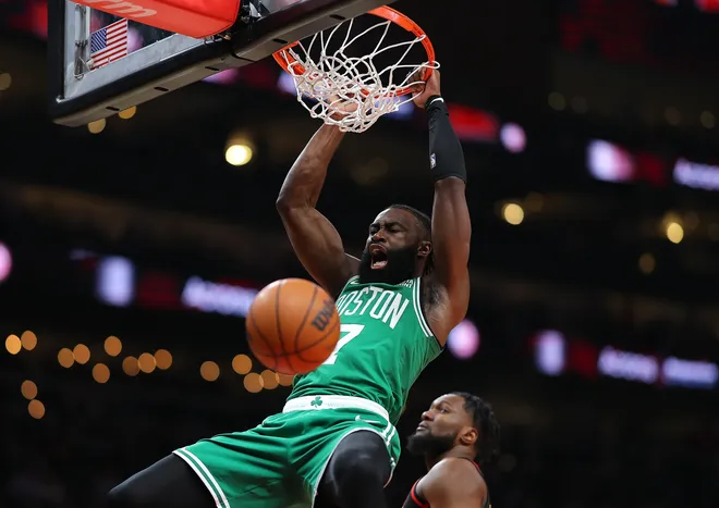 ATLANTA, GEORGIA - MARCH 28: Jaylen Brown #7 of the Boston Celtics dunks against Bruno Fernando #24 of the Atlanta Hawks during the first quarter at State Farm Arena on March 28, 2024 in Atlanta, Georgia. NOTE TO USER: User expressly acknowledges and agrees that, by downloading and/or using this photograph, user is consenting to the terms and conditions of the Getty Images License Agreement. (Photo by Kevin C. Cox/Getty Images)