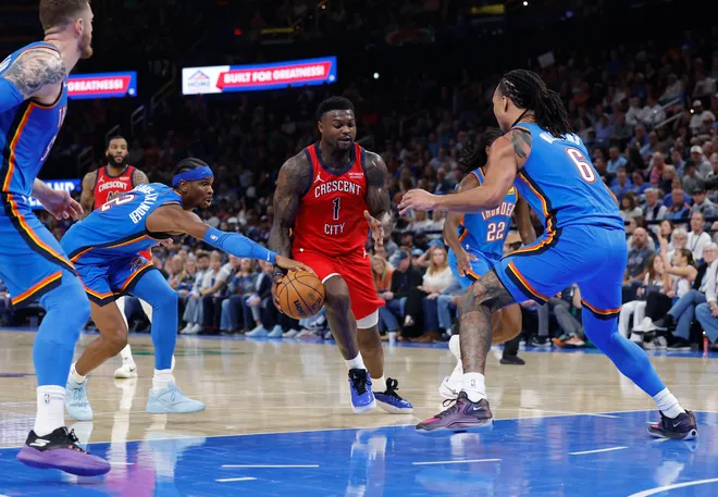 Nov 2, 2025; Oklahoma City, Oklahoma, USA; New Orleans Pelicans forward Zion Williamson (1) drives to the basket between Oklahoma City Thunder guard Shai Gilgeous-Alexander (2) and forward Jaylin Williams (6) during the second half at Paycom Center. Mandatory Credit: Alonzo Adams-Imagn Images