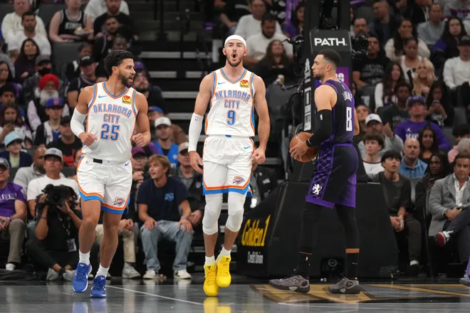 Nov 7, 2025; Sacramento, California, USA; Oklahoma City Thunder guard Alex Caruso (9) reacts next to guard Ajay Mitchell (25) and Sacramento Kings guard Zach LaVine (8) after dunking the ball in the second quarter at the Golden 1 Center. Mandatory Credit: Cary Edmondson-Imagn Images