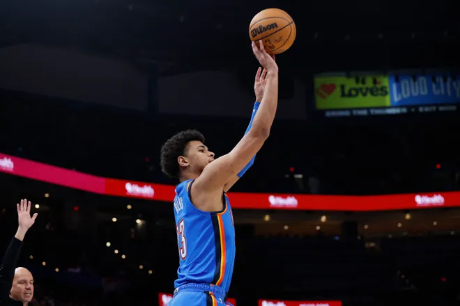 Nov 23, 2025; Oklahoma City, Oklahoma, USA; Oklahoma City Thunder forward Ousmane Dieng (13) shoots a three point basket against the Portland Trail Blazers during the second half at Paycom Center. Mandatory Credit: Alonzo Adams-Imagn Images