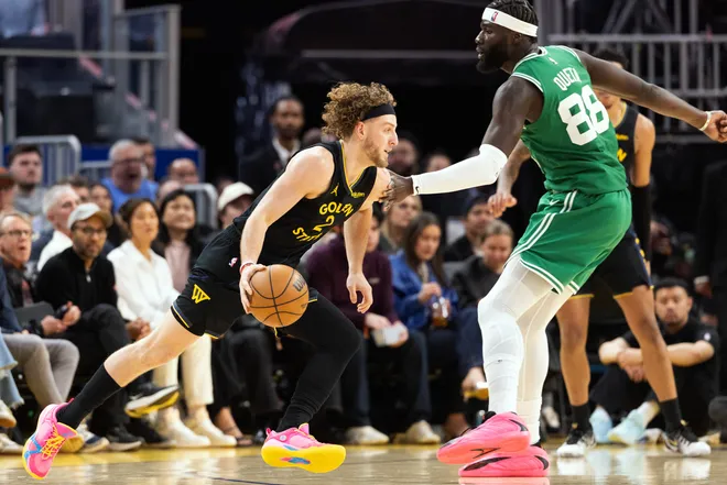 Feb 19, 2026; San Francisco, California, USA; Golden State Warriors guard Brandin Podziemski (2) speeds by Boston Celtics center Neemias Queta (88) during the second quarter at Chase Center. Mandatory Credit: D. Ross Cameron-Imagn Images