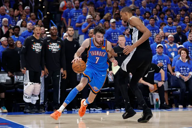 May 30, 2026; Oklahoma City, Oklahoma, USA; Oklahoma City Thunder center Chet Holmgren (7) drives against San Antonio Spurs forward Victor Wembanyama (1) in the fourth quarter during game seven of the western conference finals for the 2026 NBA playoffs at Paycom Center. Mandatory Credit: Alonzo Adams-Imagn Images