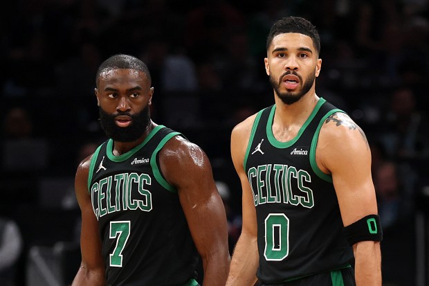 Jayson Tatum #0 of the Boston Celtics and Jaylen Brown #7 look on in Game Five of the Eastern Conference First Round NBA Playoffs against the Orlando Magic at TD Garden on April 29, 2025 in Boston, Massachusetts. NOTE TO USER: User expressly acknowledges and agrees that, by downloading and or using this photograph, User is consenting to the terms and conditions of the Getty Images License Agreement.  (Photo by Maddie Meyer/Getty Images)